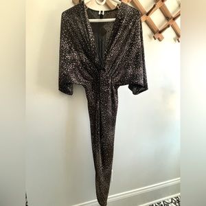 Glittery dress. Blackish brown. Flowy top. Long in the back with front slit